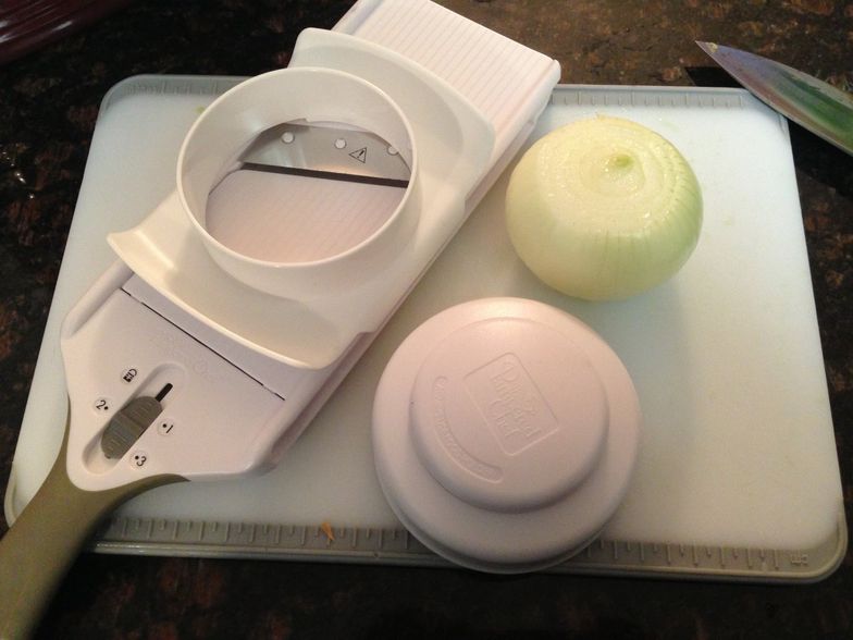 https://guides.brit.co/media-library/time-to-slice-1-large-onion-using-the-pampered-chef-simple-slicer-slice-onion-on-3-setting.jpg?id=23706682&width=784&quality=80