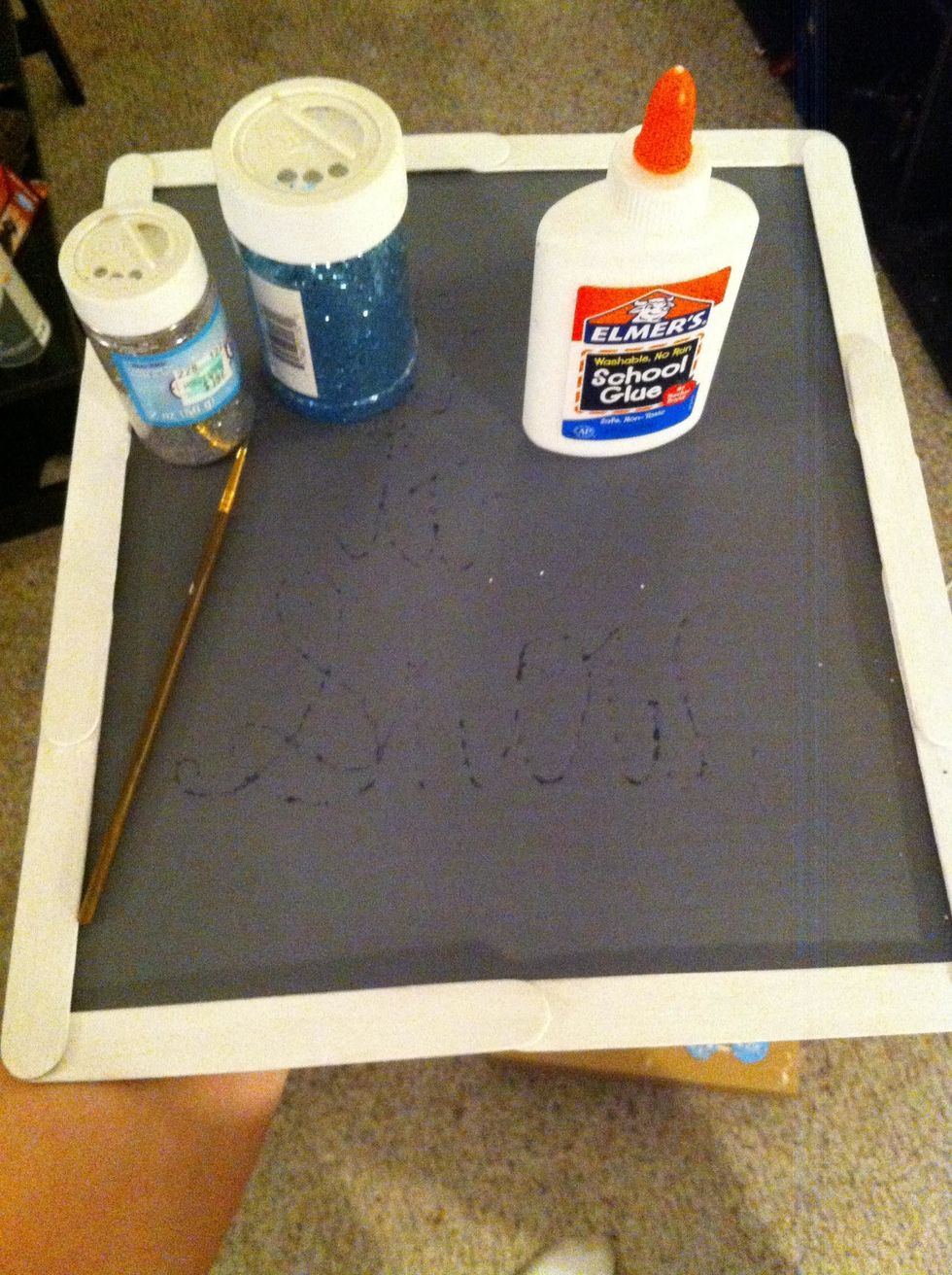 Time to write out your favorite holiday quote! As you can see, I wrote it out first before i used the Elmer's glue. Cover your quote in glitter of your choosing.