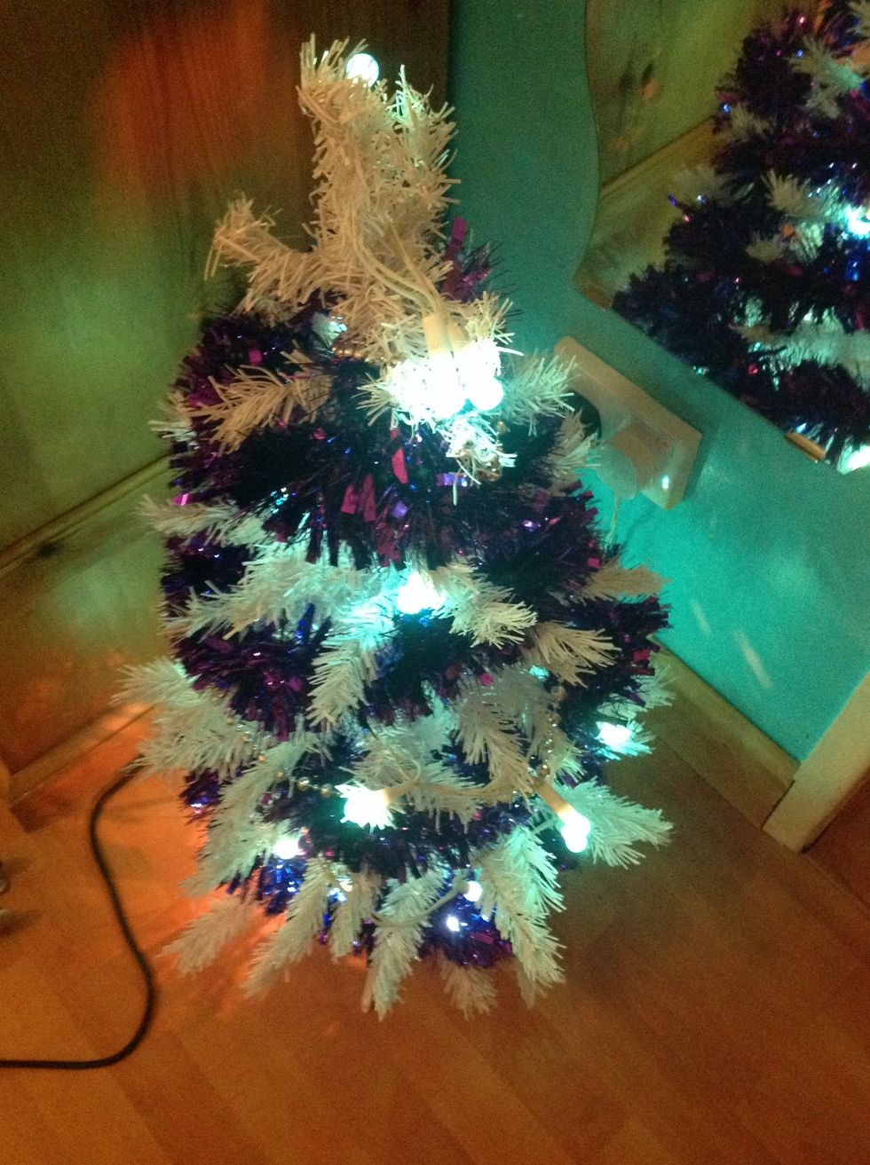 Tinsel, the tree looks less skinny and more full :)