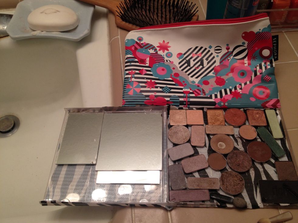 Tip: if some of the compacts you're recycling have mirrors in them, pry them out using the same techniques.  They may have some sticky glue still on the back- just press on other side of CD case.