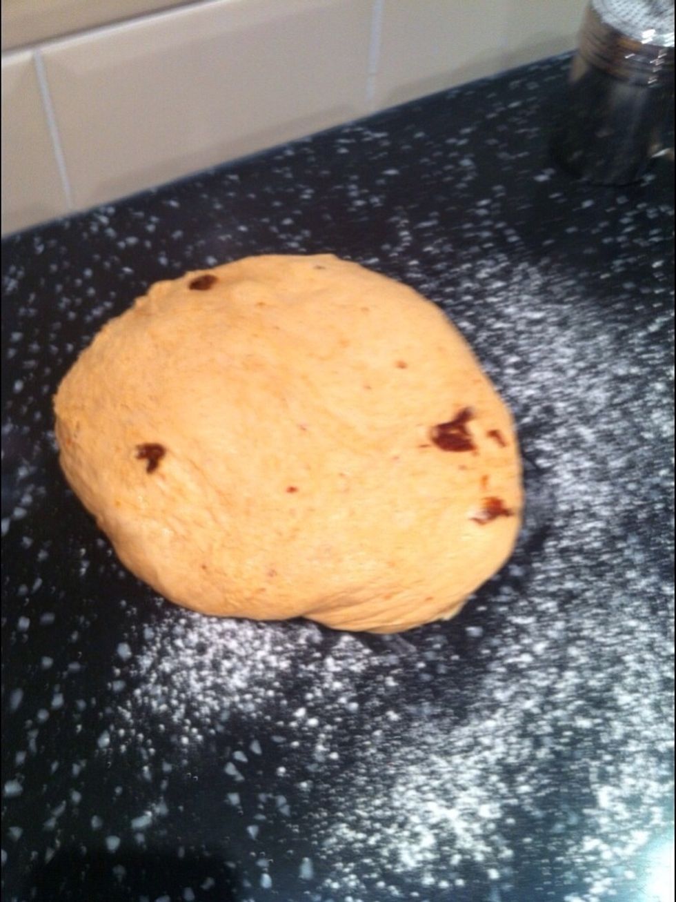 Tip out the risen dough onto a lightly floured surface