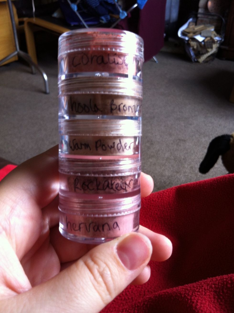 Tip powder into travel pots making sure to scrape the edges out so you get all those little bits out. Label them with a cd marker so you know which blush it is. I've done it to save space :)