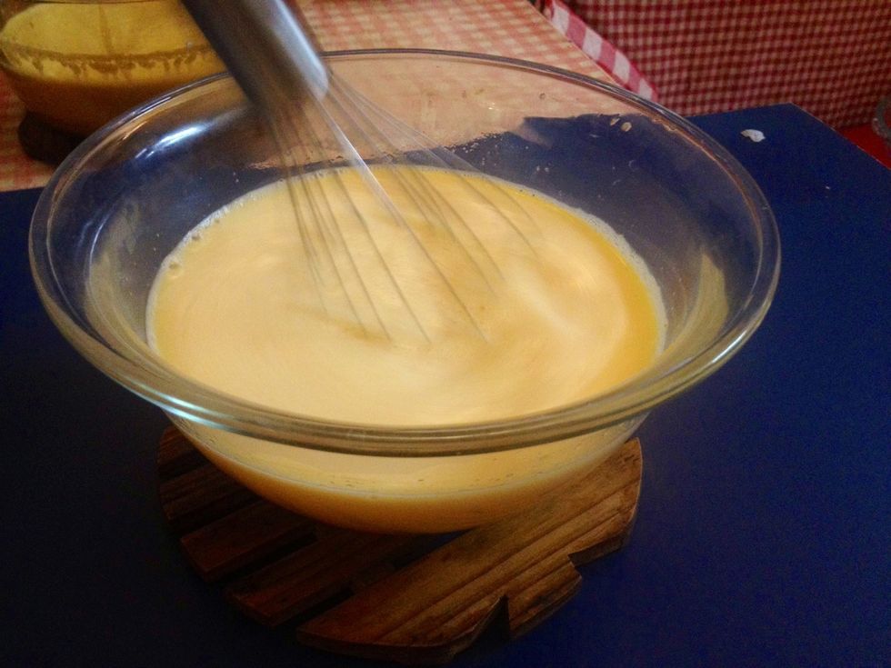 Tip: Tampering is a method of adding milk a portion at a time into egg mix to bring up temperature of eggs without making scrambled eggs out of them. Stir the mix after each addition,