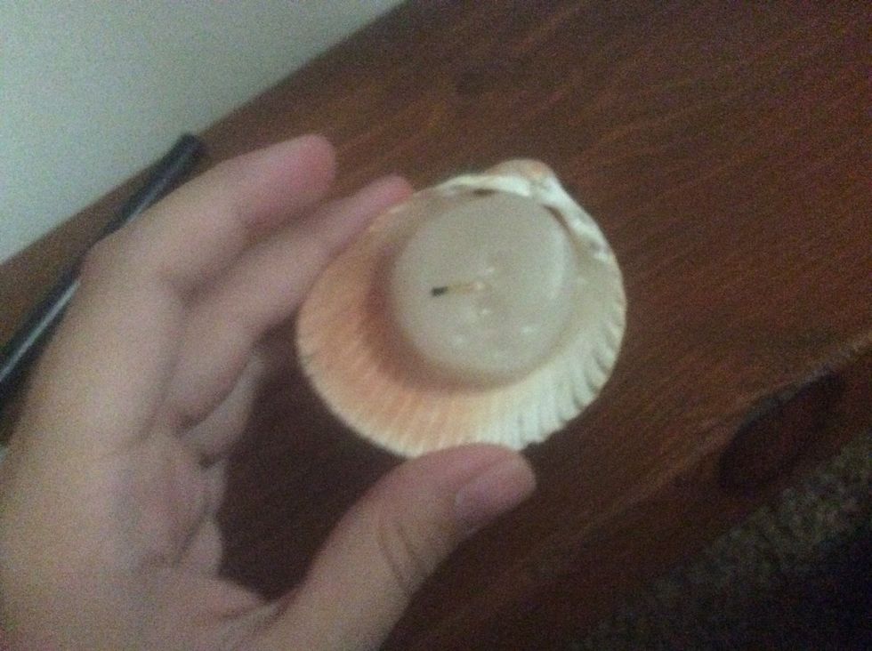 Tip the candle so the wax gets in the cracks