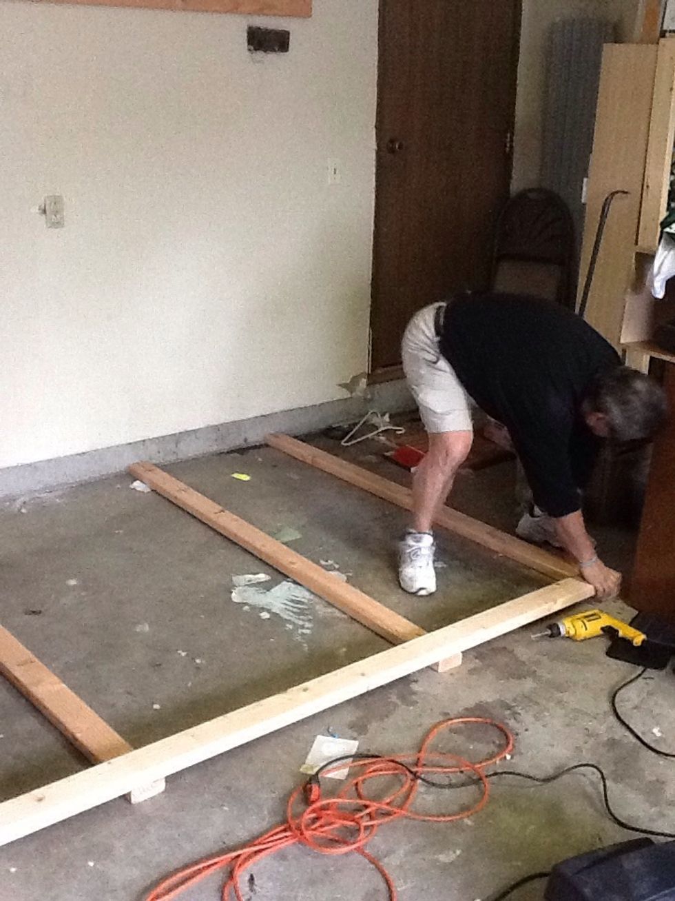 Tip: The legs tend to move while framing this section. Use a square to make sure the edges are even, and measure both the top and the bottom of the legs to improve accuracy.