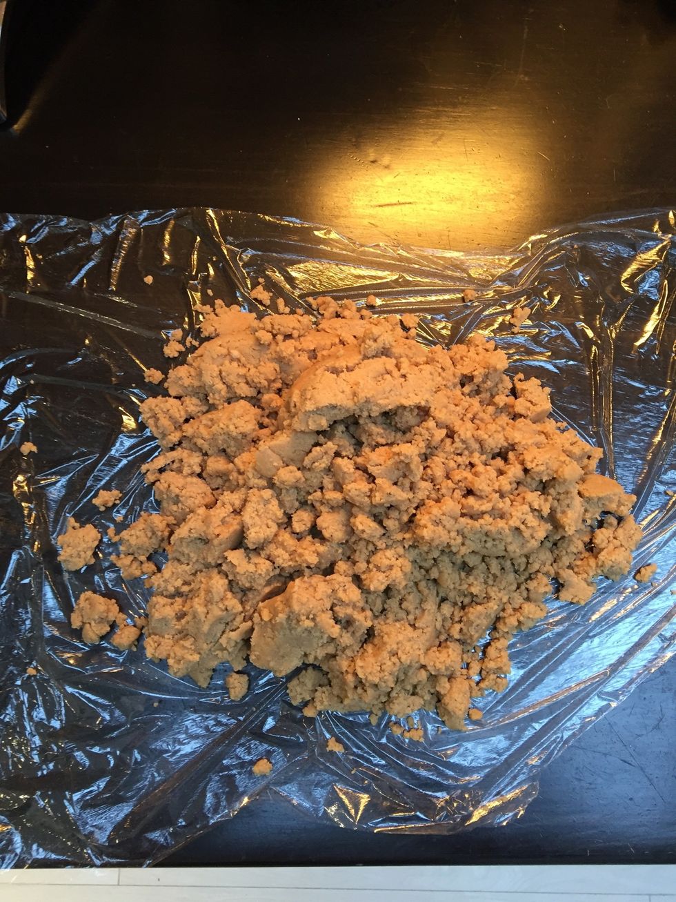 Tip the mixture out onto cling film and knead briefly to bring it all together.