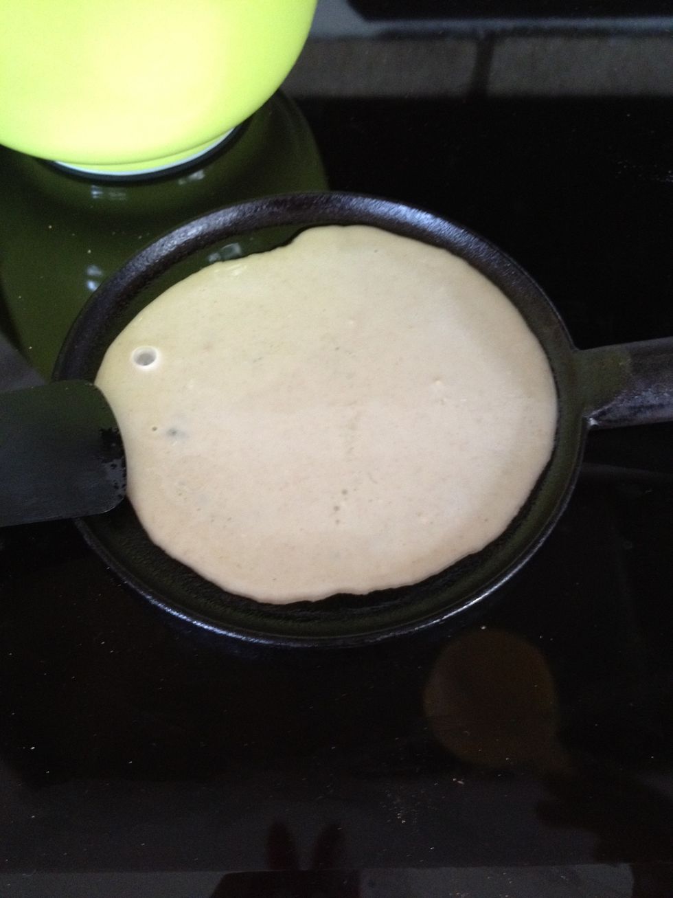 Tip the pan to spread it all over