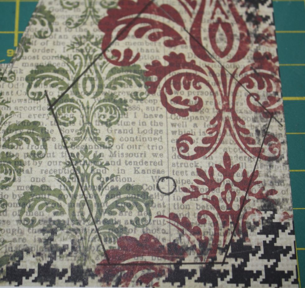 Tip:  To make a template for the front and back of the birdhouse I copied the birdhouse on my printer.  I taped it to my patterned paper with a post-it note and used a ruler and knife to cut it out.