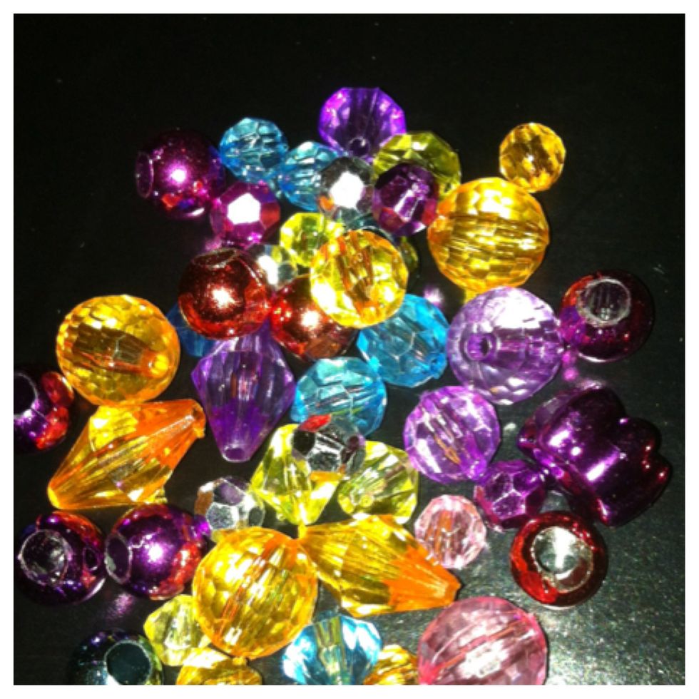 Tip: use a hot glue gun to attach 3D objects such as beads. Also remember to apply a protective coating when using glitter or leaves (but that's another topic all together)