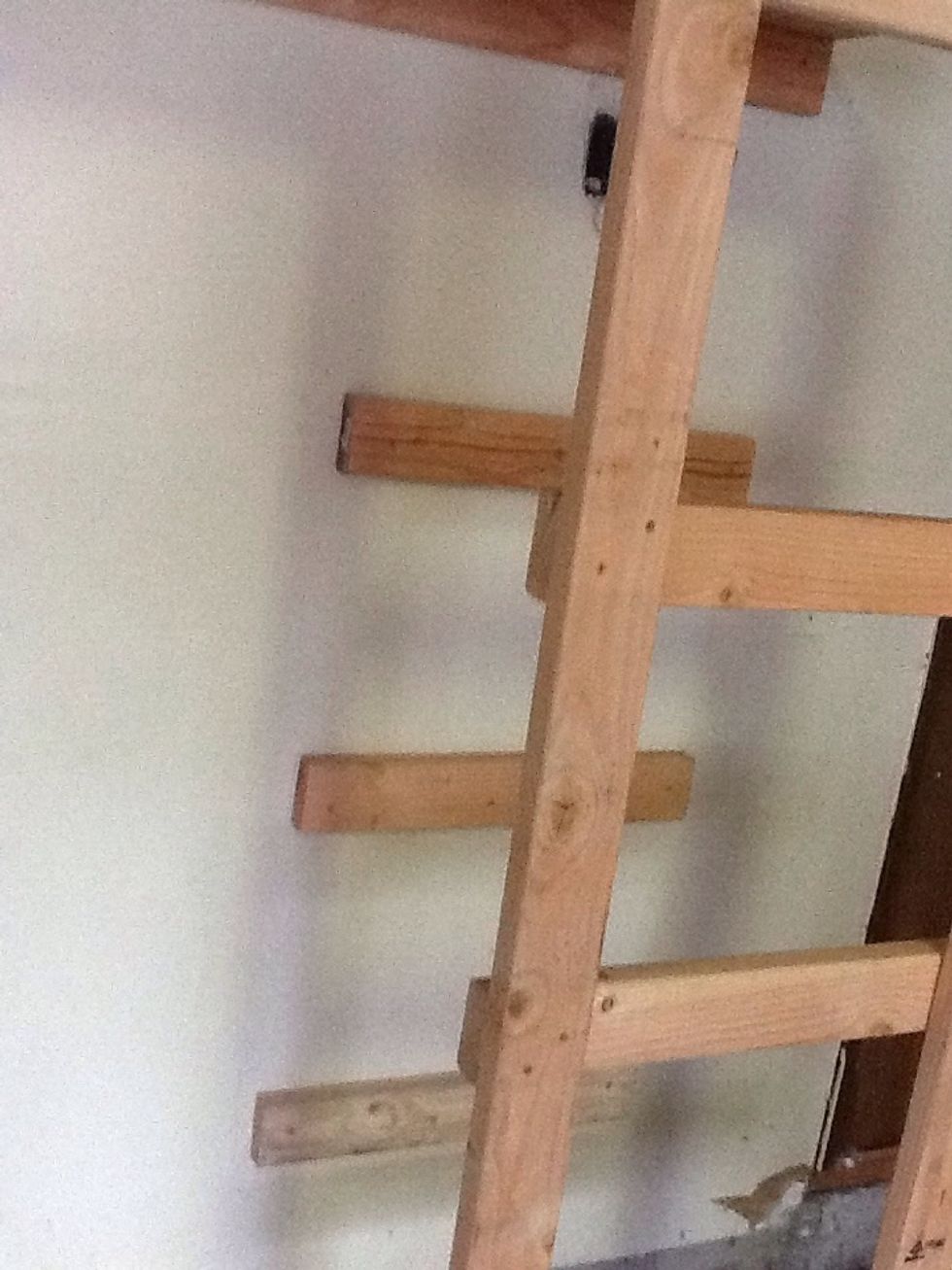 Tip: You can place a longer level from the front braces to the ones on the wall to ensure they are the same height.