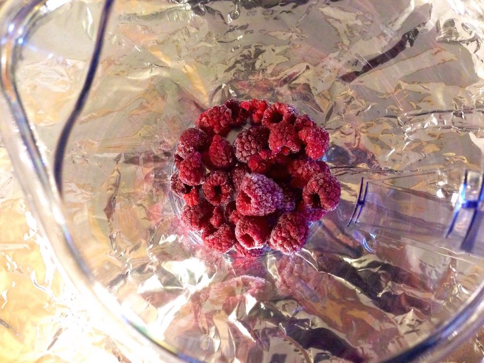 To a jug, bowl etc add frozen raspberries..