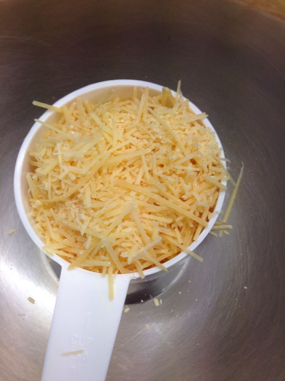 To a large bowl add 1 cup of grated Parmesan cheese