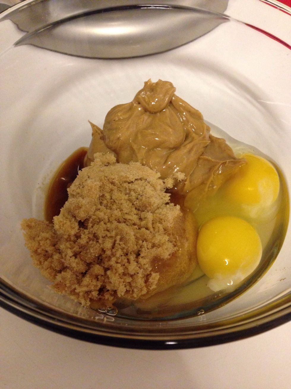 To a medium bowl, whisk together the peanut butter, eggs, brown sugar, and vanilla extract until complete smooth.