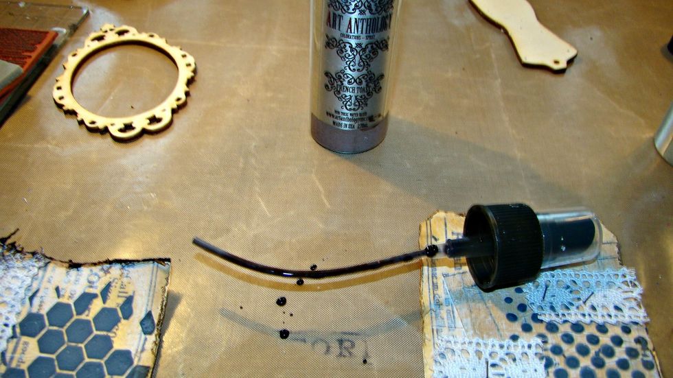 To add a vintage aged look to the edges, the used Colorations in Warm on one tag and French Toast on another. Remove the nozzle and just drip the ink on the edges and allow to run on the tag.