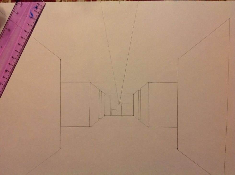 To add ceiling lights draw to diagonal lines from the vanishing point to the top edge of your paper. It should look like a "v".