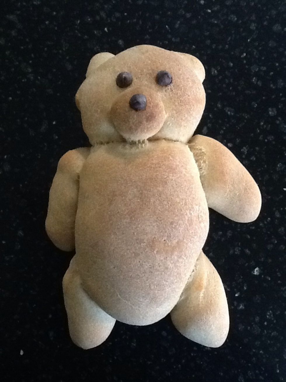 To add eyes and noses, microwave 6 chocolate chips for about 10 to 20 seconds, until the chips haven't melted but bottoms are soft. Place eyes and nose on each bear. Enjoy!