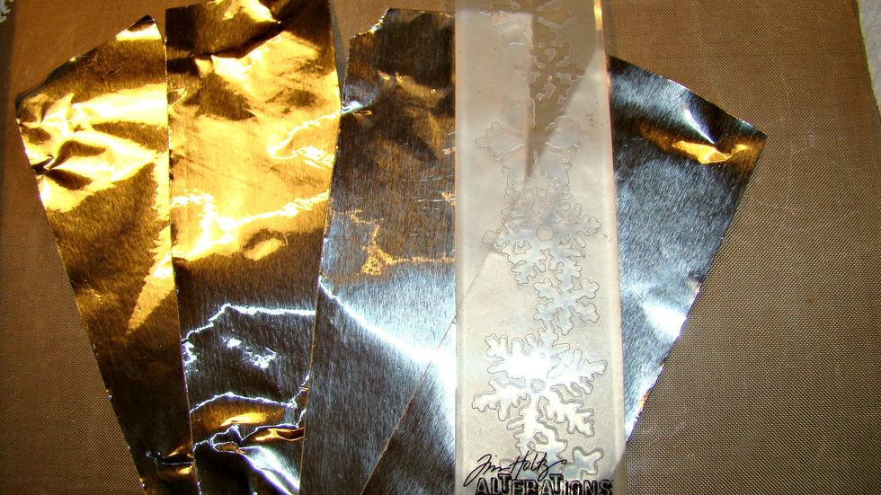 To add interest I decided to run metal plumbers tape through embossing folder and cut in strip to apply to the outside sides of the box over the Christmas paper.