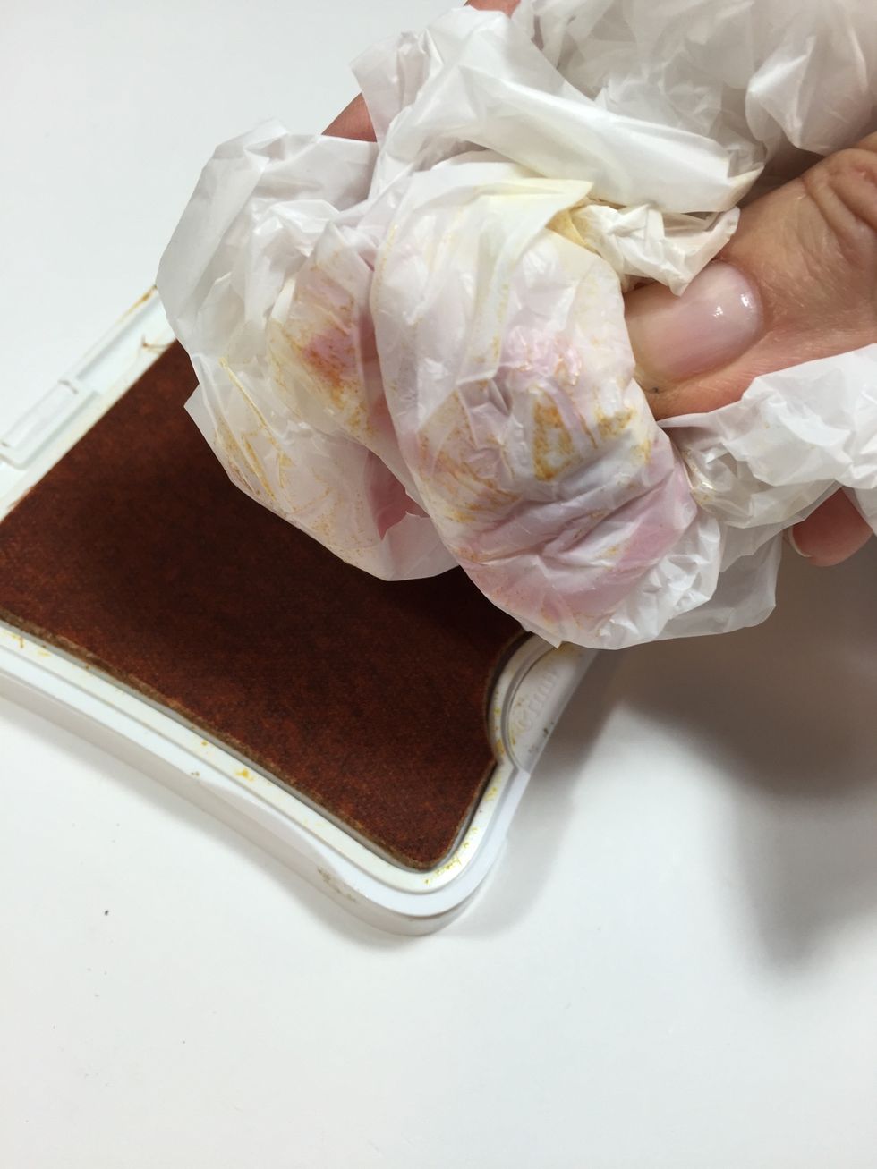 To add some texture to match the feel of your card, wad up a plastic grocery bag and press into desired ink color. My bag is from Target and I'm using a golden yellow ink pad.