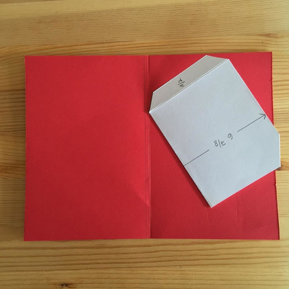 To adhere it to the base put the piece this way. Glue only the tab.