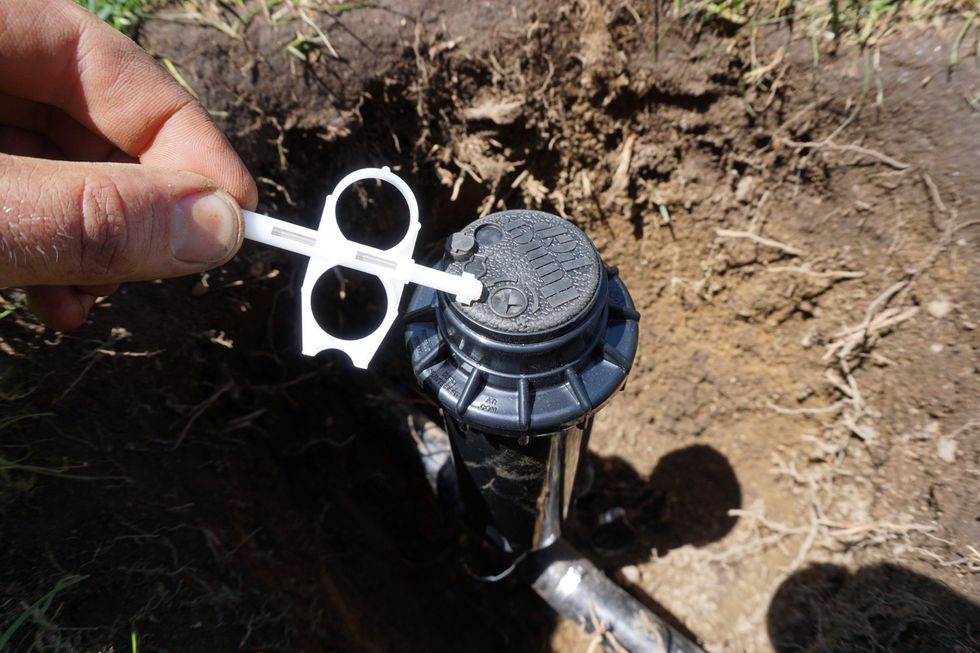To adjust where it stops as it sweeps to your left, or counter clockwise, you will use this "key" that comes with the rotor. You will stick it into the covered hole as shown on the next page.