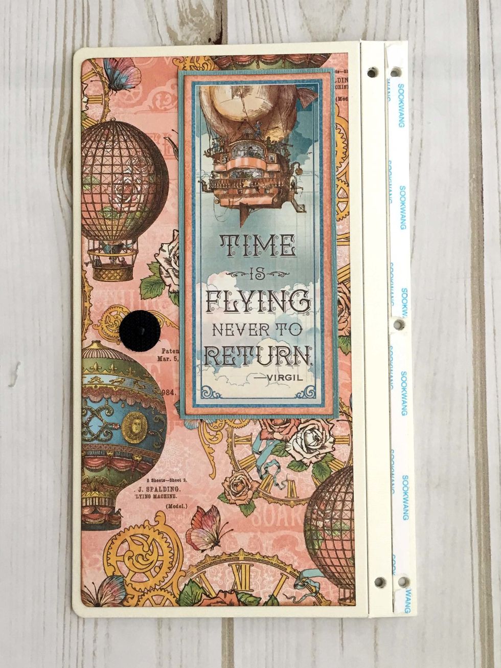 To assemble the cover, place 1/4" Scor-tape on the back cover as shown.  Line up the holes on the front and back covers and press the two covers firmly together.
