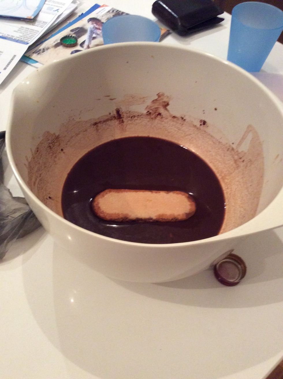 To assemble the tiramisu, dip 1 savoiardi biscuit into the cocoa mixture for 10 seconds to soften, then place in the base of a 1.5L (6-cup) capacity dish.