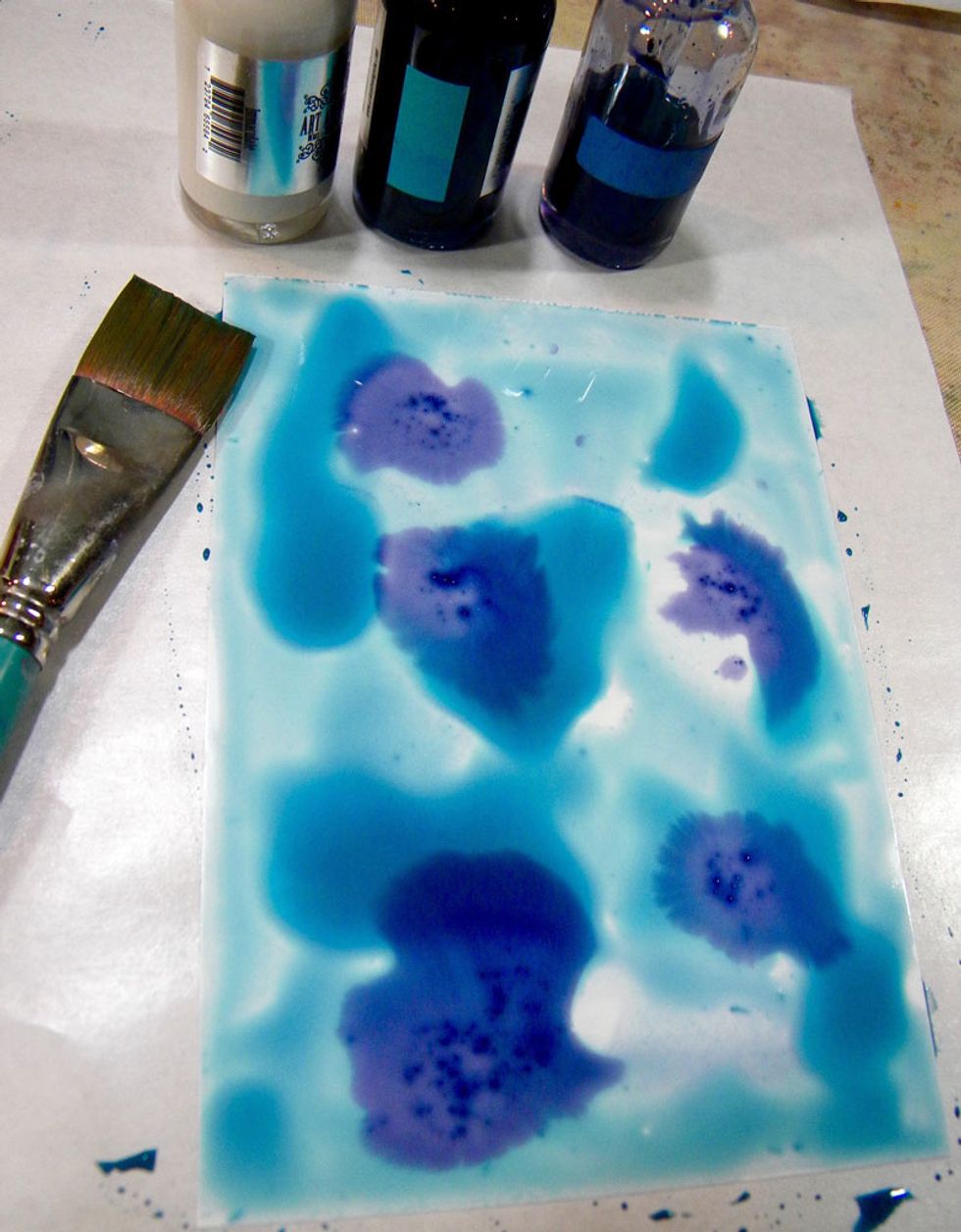 To avoid making muddy colors, I kept warm and cool colors separate. Drop Panache (turquoise) and Stargazer (blue) Minx onto Yupo. Tilt the paper so the colors mix a bit.