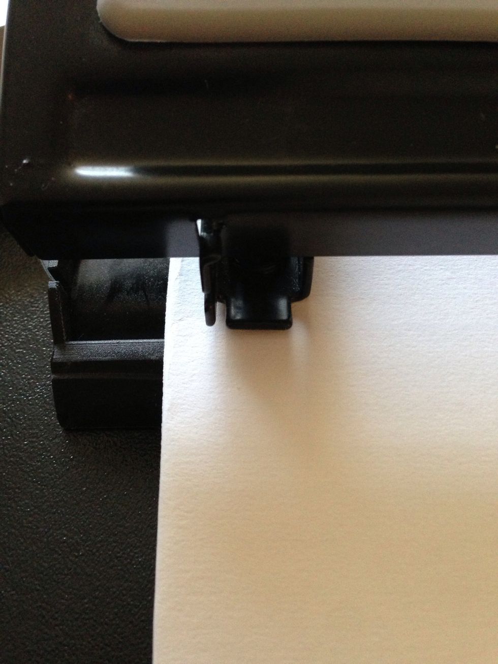 To be sure that the hole isn't to close to the side, have about a centimeter of the note card out to the side of the hole punch. No need to be precise. Just eyeball it \ud83d\ude18