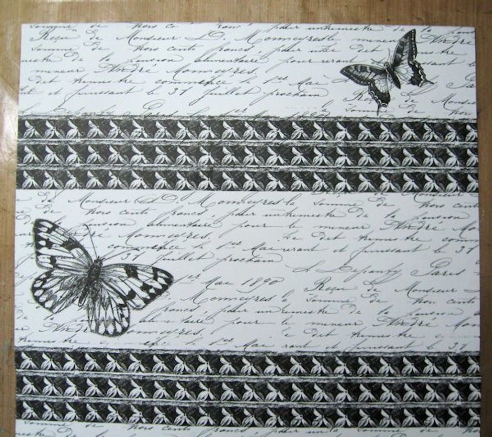 To begin, you will need one 12 x 12 sheet of Canvas Corp Brands Mixed Media Origins "Wings" paper.  It's double sided, but we are using the butterfly/script side.