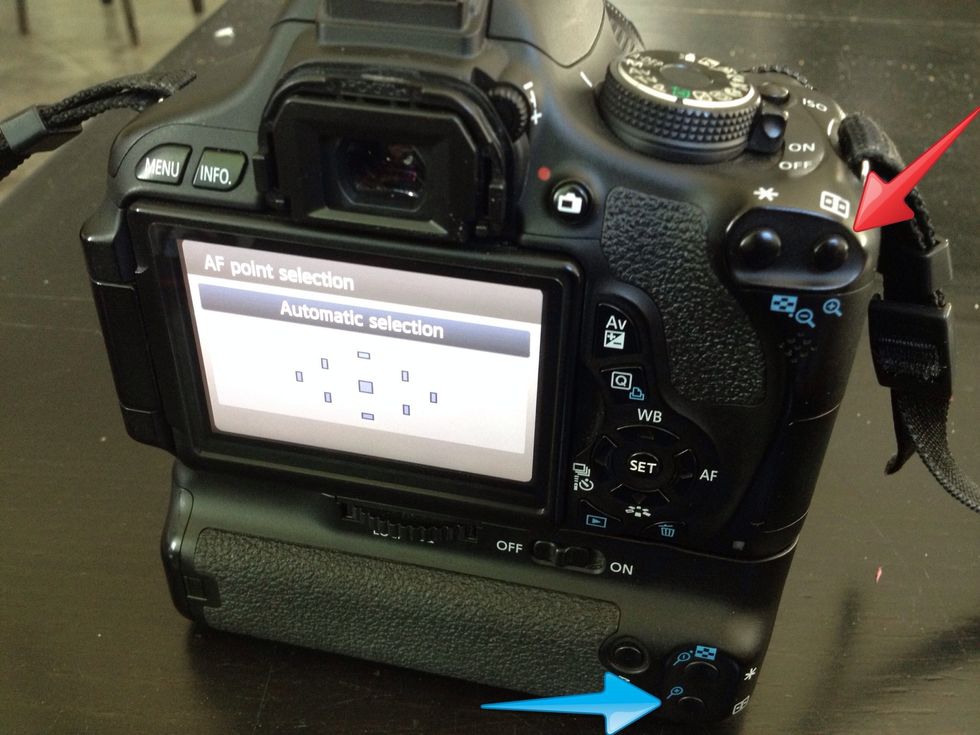 To change your autofocus points, push the "zoom in" button on either the top right of your camera or on your vertical grip