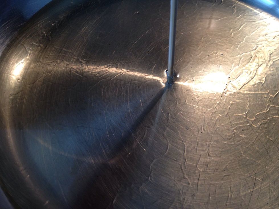 To check if oil is hot enough, dip a bamboo skewer into the oil. If rapid bubbles appear, the oil is ready.