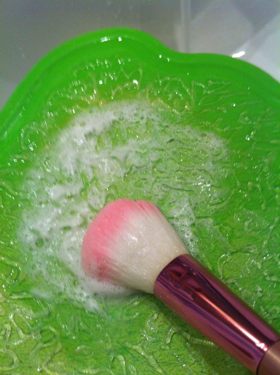 To clean the brushes just swirl them around on the board. This helps very well with the in depth cleaning and you won't have to get foundation all over your hands again.