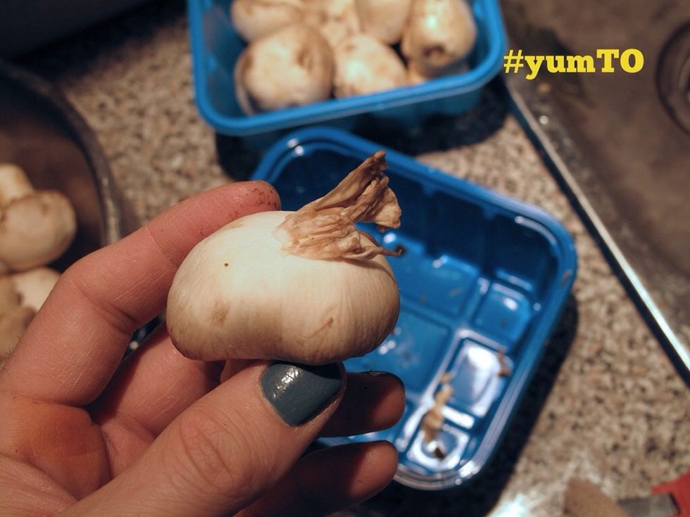 To clean the mushrooms push the top skin from the bottom up with a dry cloth. A very thin layer will concentrate at the top.