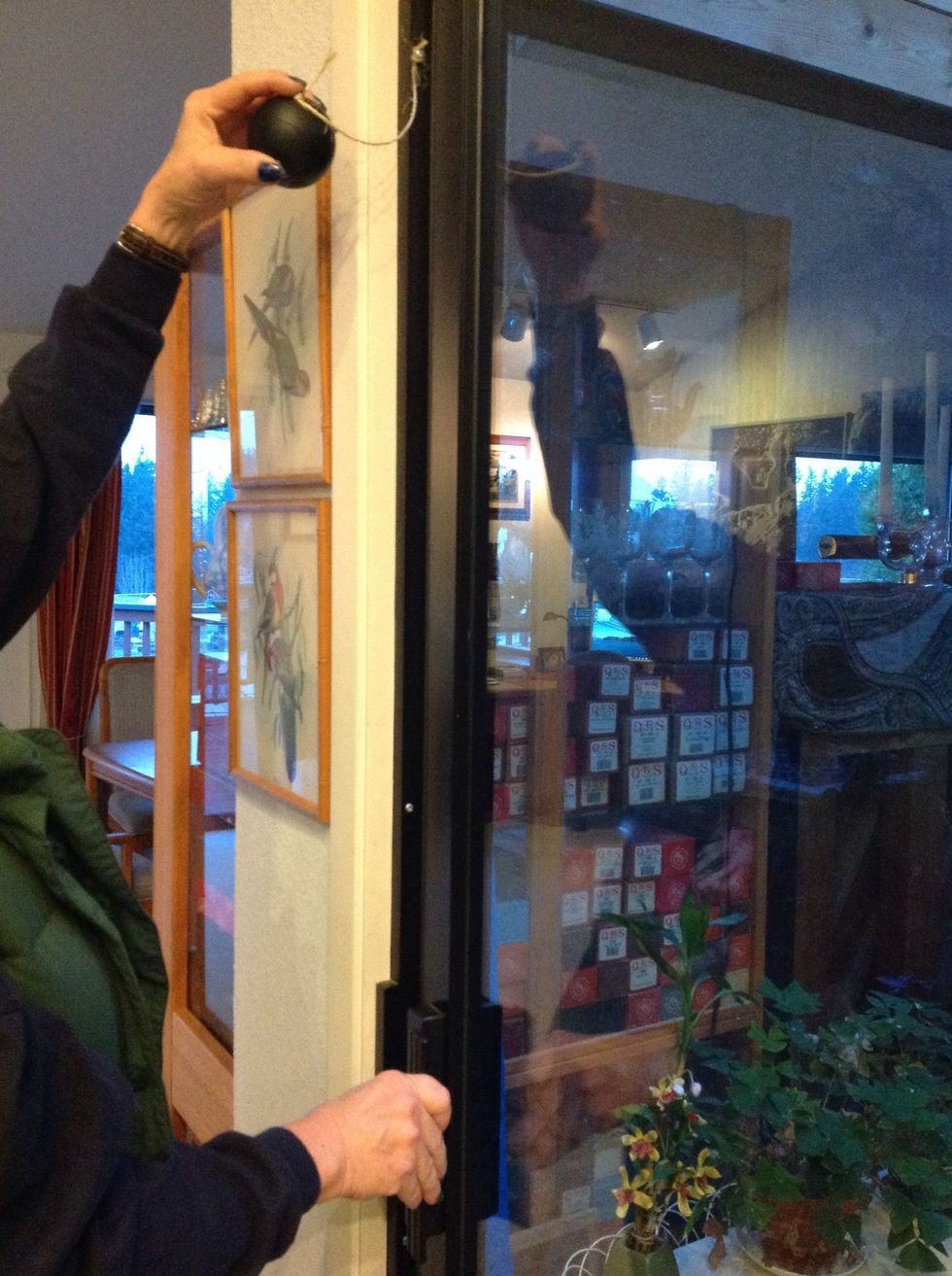 To close the door, swing the ball to the side. Children won't be able to reach the ball. The door will latch as normal.