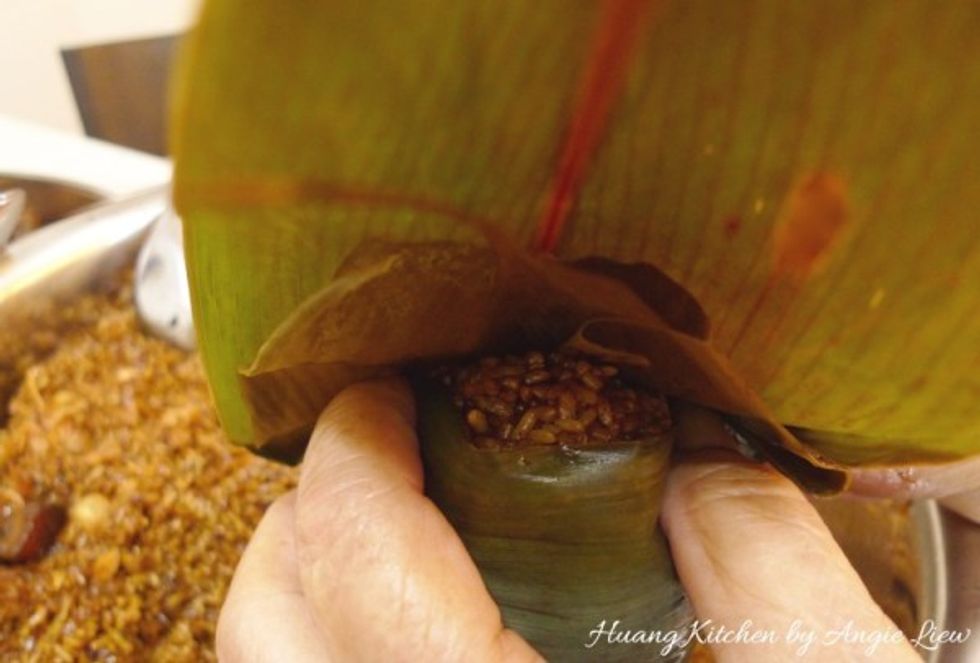 To close the opening, fold over the remaining 2/3 of the leaves.