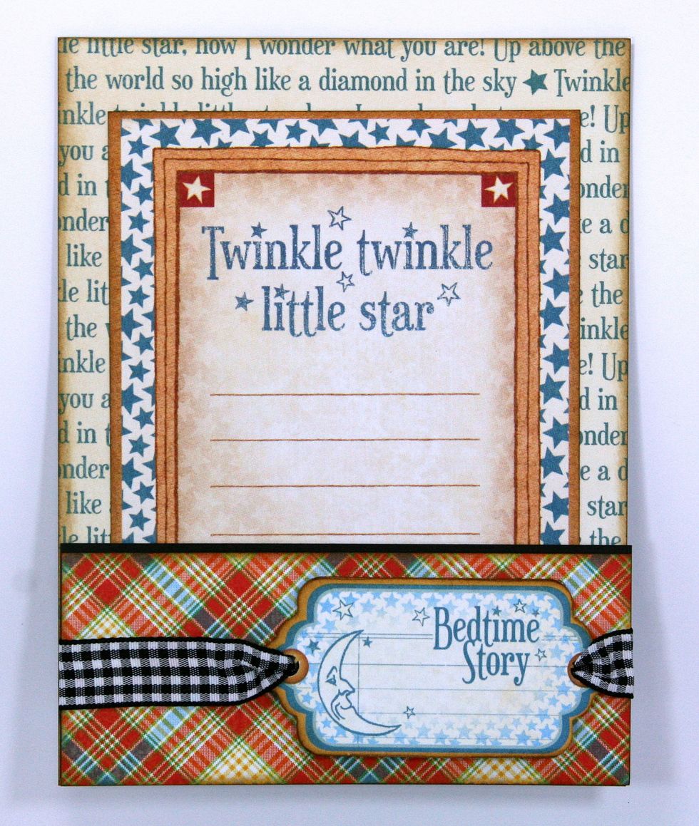 To complete the inside I added more of the plaid paper with a black cardstock strip to separate the patterns. I also added the fun chipboard tag with the black gingham ribbon.