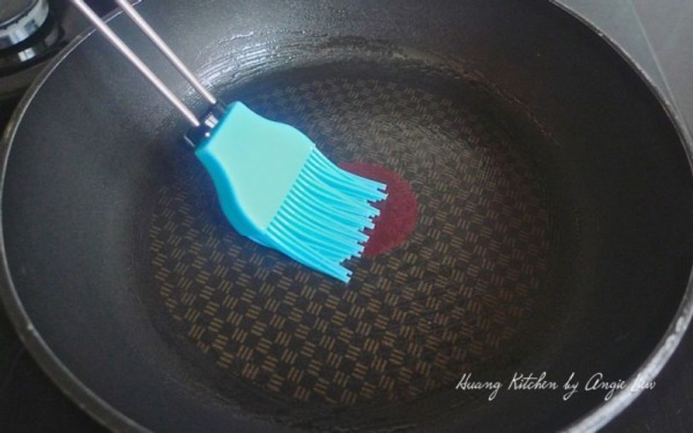 To cook the pancake, first lightly oil a non-stick pan over medium high heat.