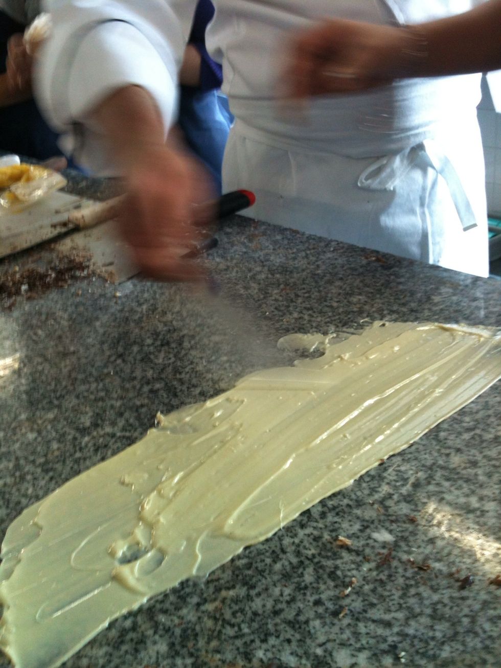To Cool the chocolate (26 degrees) we should stir it on the marble table until we feel that is cold