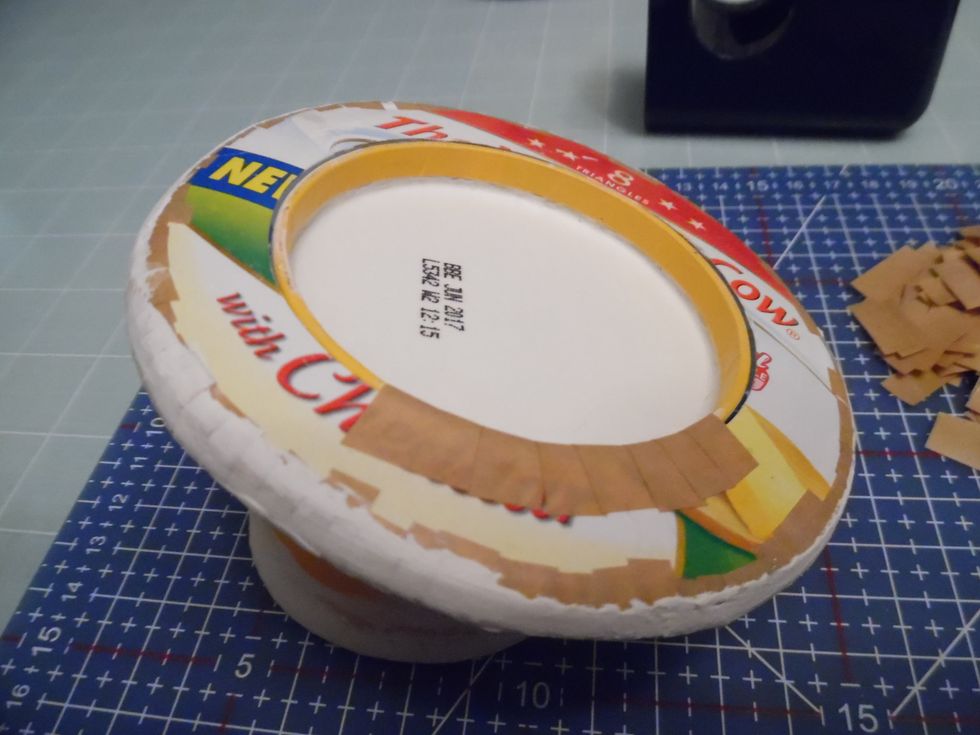 To cover any gaps and clean up the rough edges, repeat on the underside of the brim. This also provides additional strength.