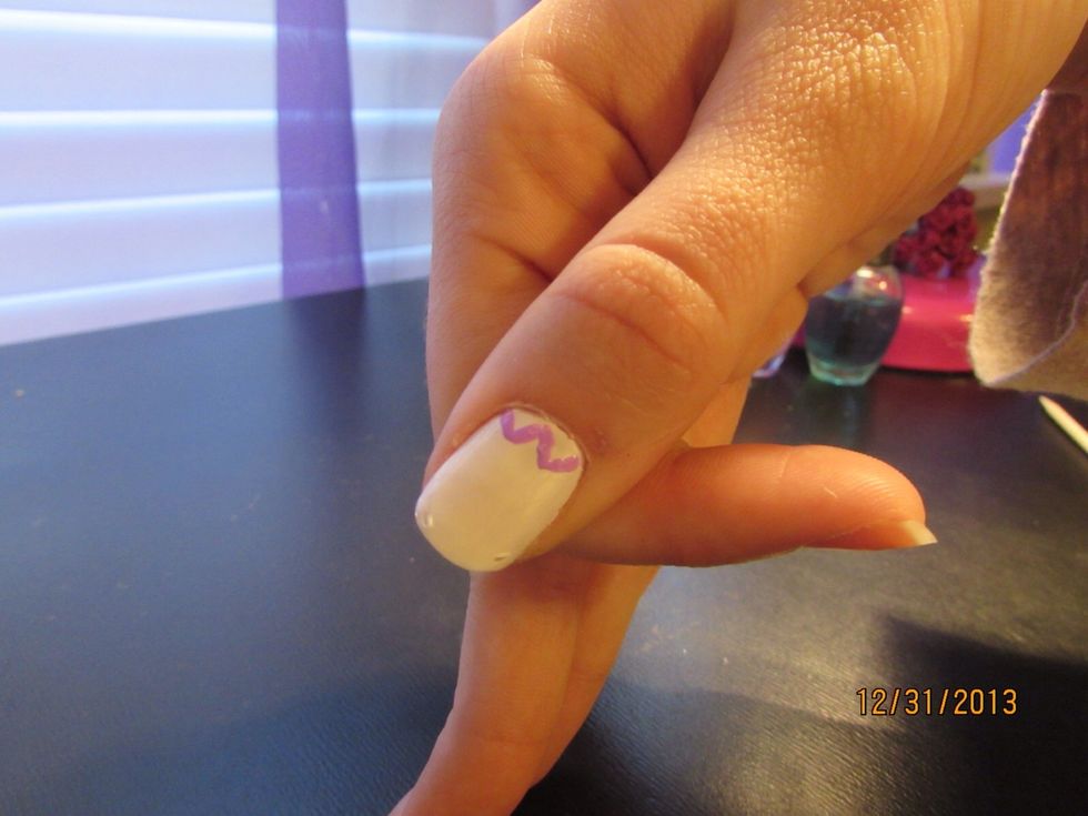 To create a chevron design, start at the bottom of your nail and make short diagonal lines. Alternate the lines as you go horizontally across your nail.