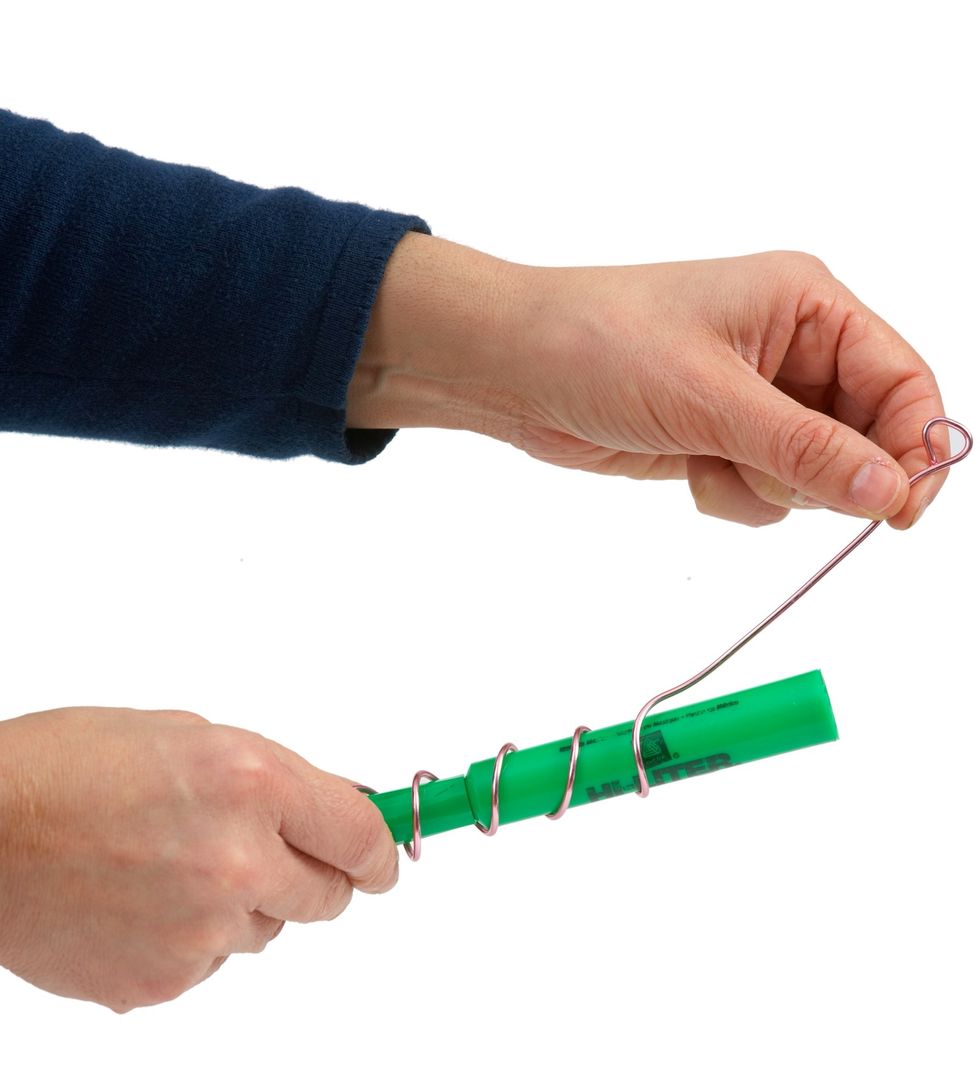 To create tail, cut 1/2 Yard of pink aluminum wire. Roll wire around a marker or highlighter to create a spiral. Leave about 3" strait to insert into oasis.