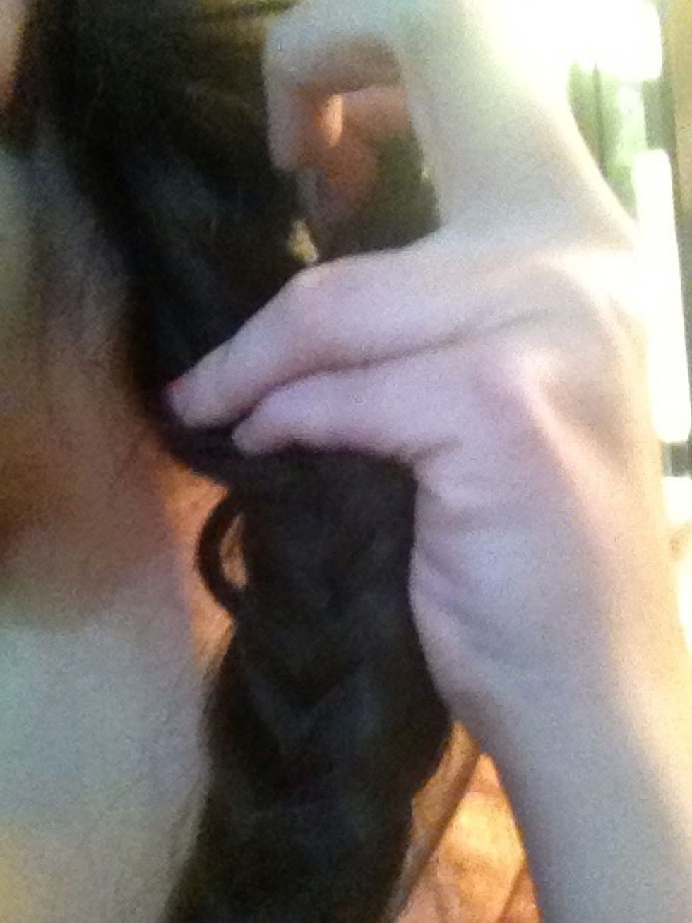 To create the braid within a braid effect, you will need to make a hole towards the top of the braid. Then push the braid into the hole and pull it through.   **click on picture for full**