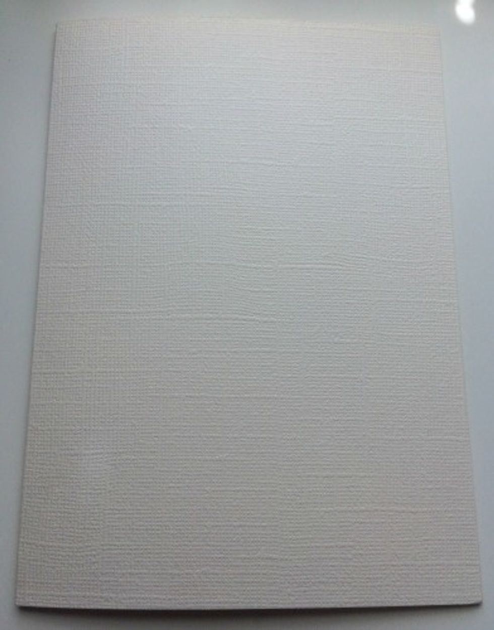 To create the card base, you'll need to cut a piece of Cream Puff Cardstock to 7" x 10". Score at 5". Fold the card in half.