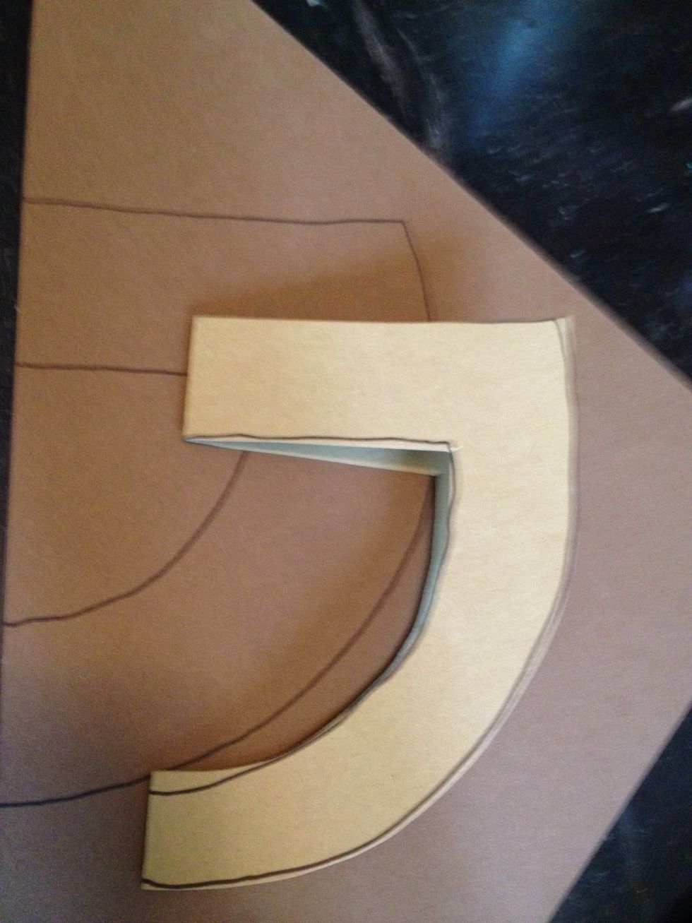 to create the handle, I folded a scrap of light brown paper and traced & cut a 'D' shape. than I traced the handle a 1/2 inch larger onto the dark brown paper and cut it out as well.