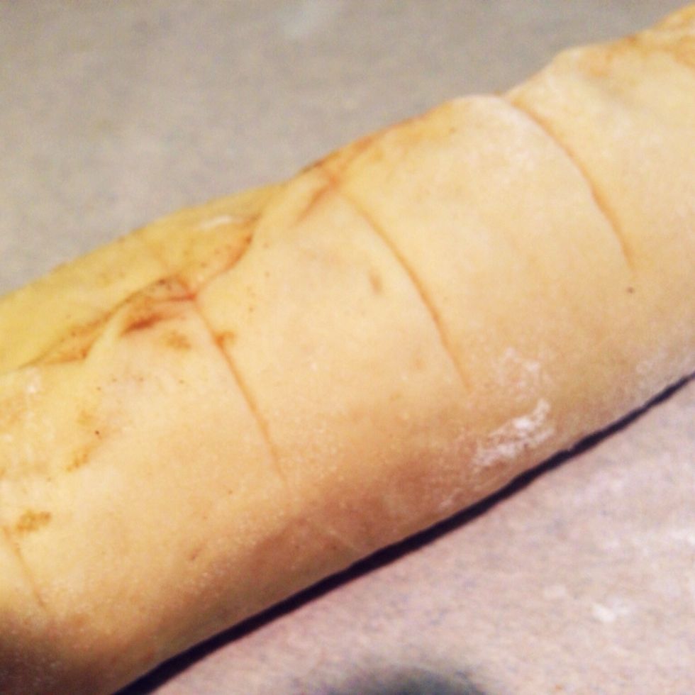 To cut the rolls, first make a roll in the center of the dough. Then cut eight rolls on each side of the center roll. A yardstick can be used to aid in cutting.