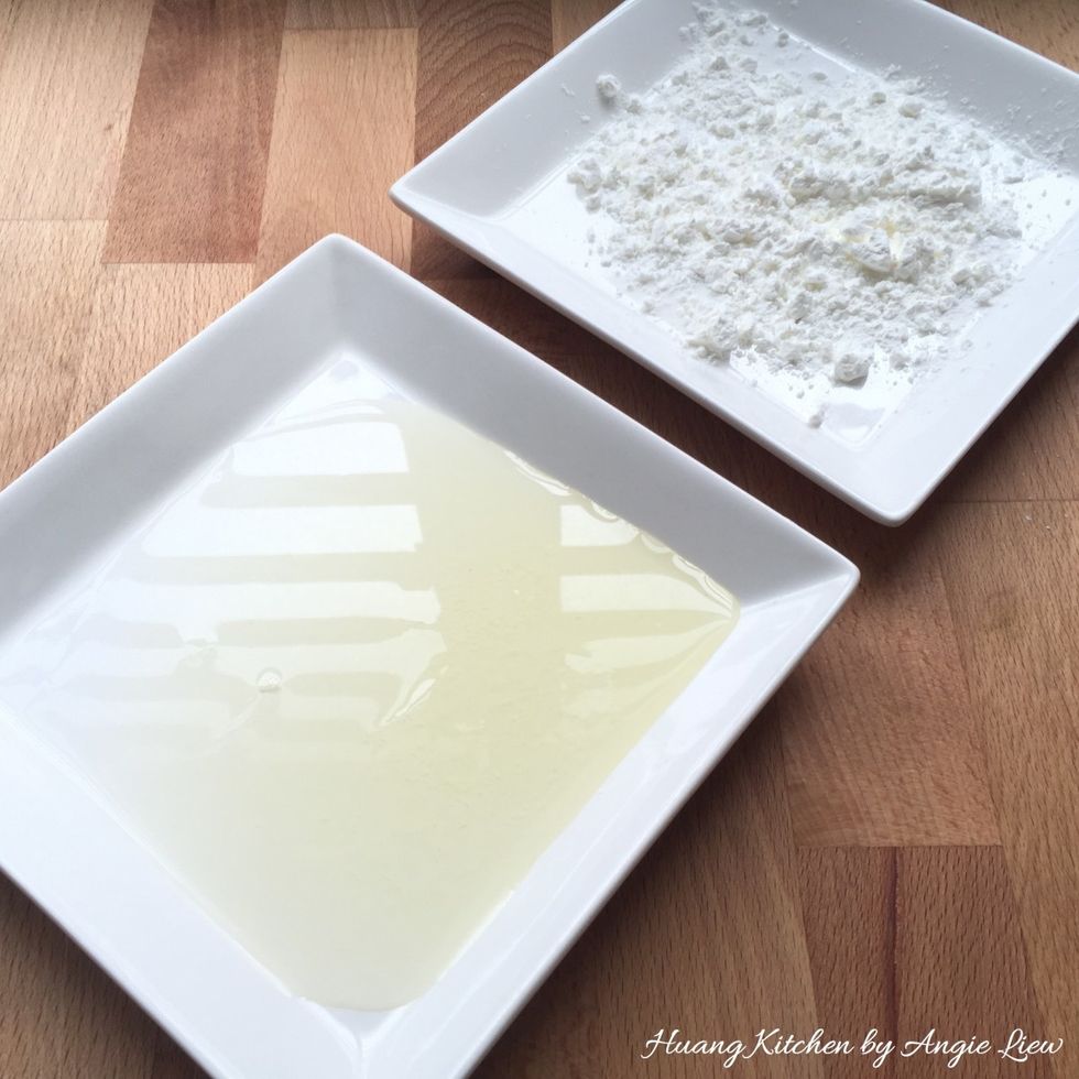 To deep fry, first prepare some egg white and cornflour in 2 separate shallow plates.