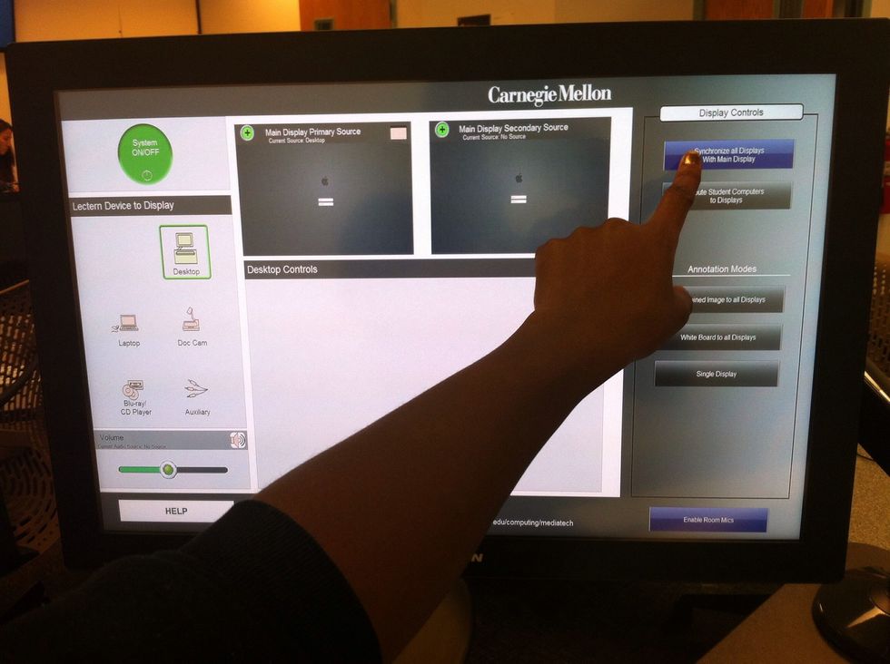 To display the primary source on the LCDs located on walls around the room, select "Synchronize all Displays With Main Display" under Display Controls.