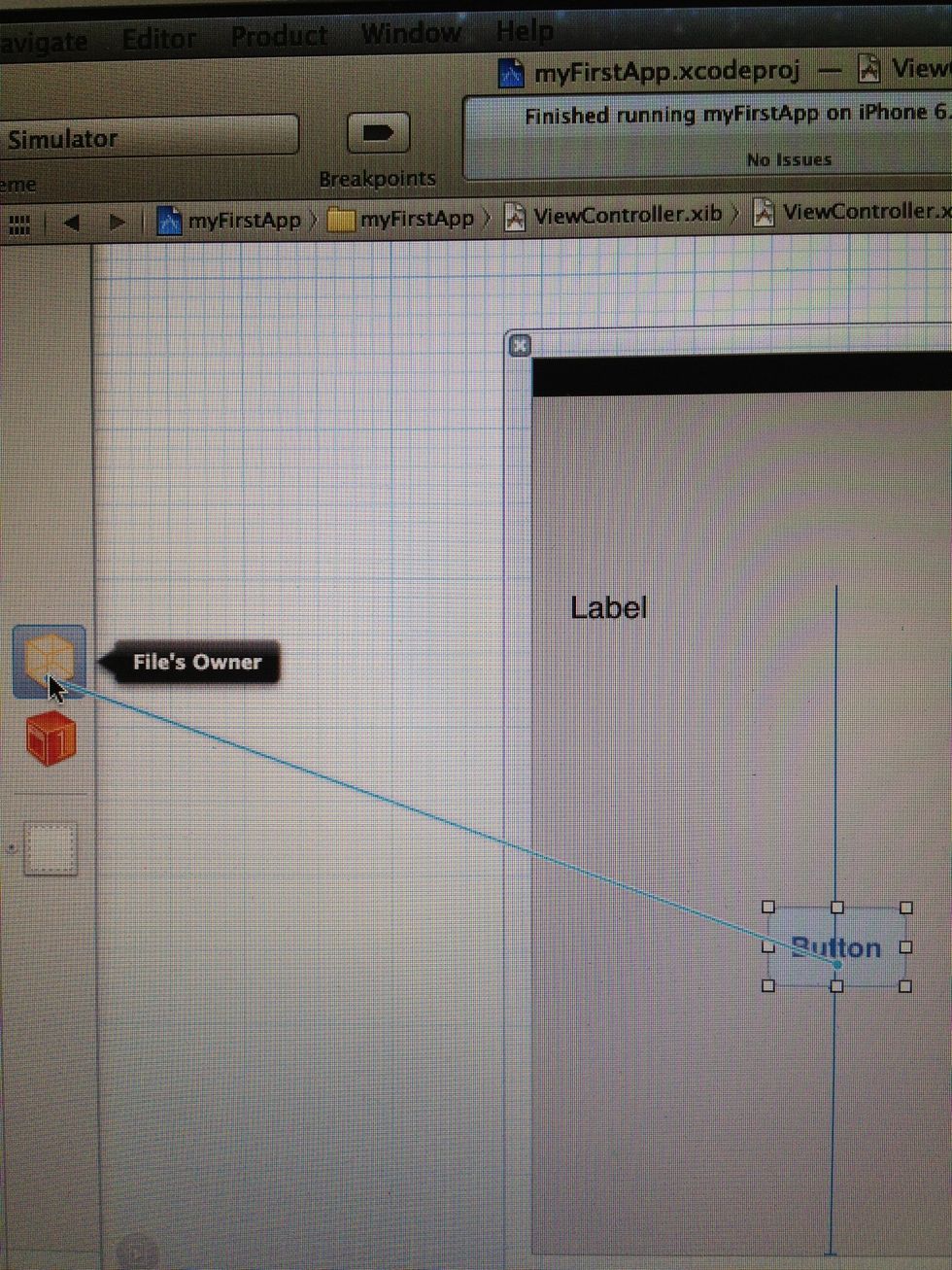 To do that, we change to ViewController.xib, and as we have done before, we click and hold ctrl key and mousebutton while draging a line from our button to the little box on the left. Than release...