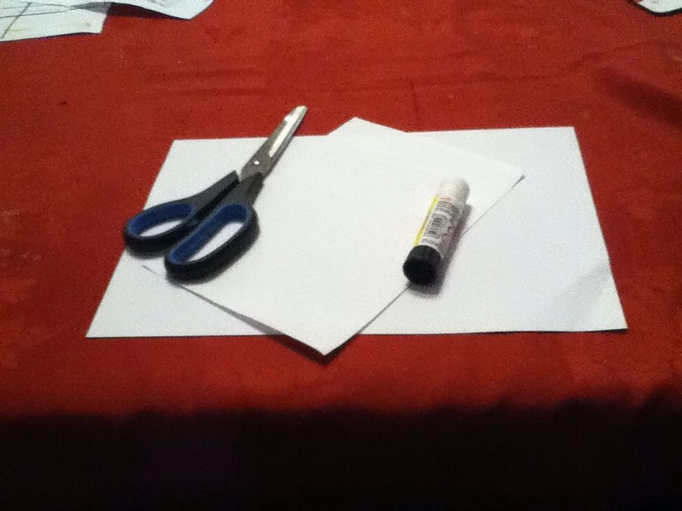 To do this you need an A4 piece of paper, a glue stick, a pair of scissors and an A5 piece of paper (or cut an A4 piece in half