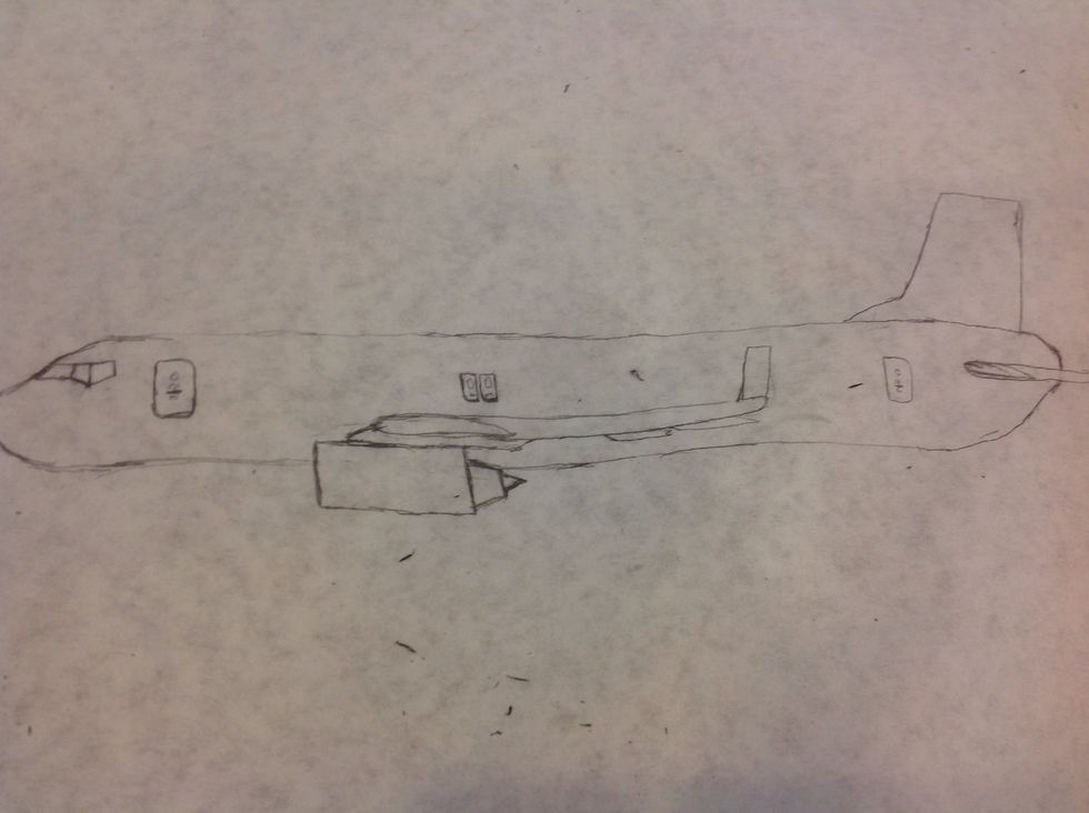To draw the emergency escape windows, first draw two ovals about the center of the plane and over the wing. Next, draw a rectangle around each of the ovals.